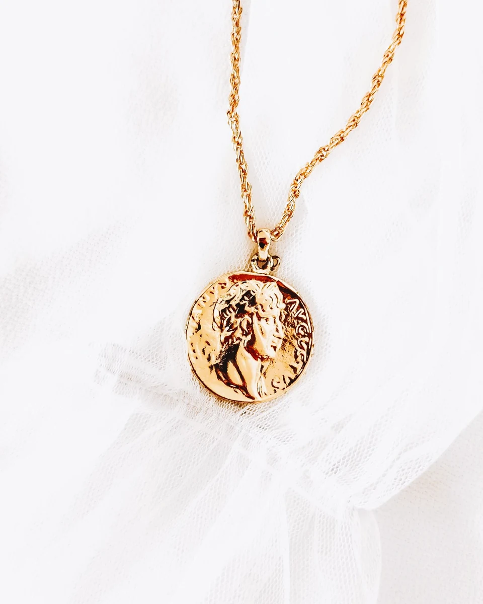 Sunehri gold-tone relief medallion on a delicate chain