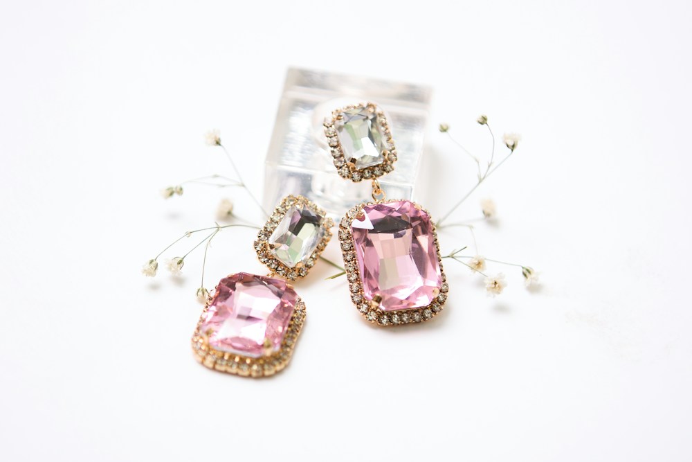 Pink stone drop earrings with gold-tone settings